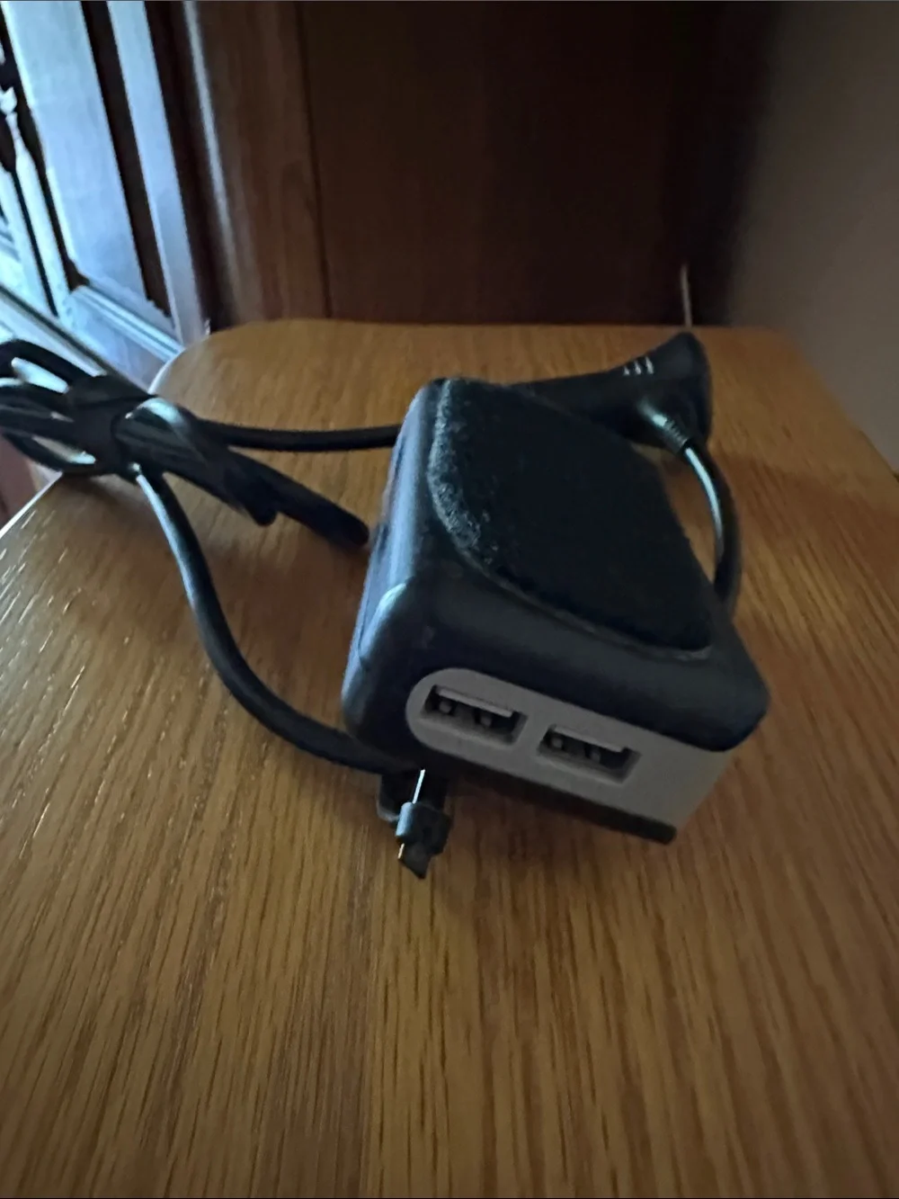 Black In-Car Charger Adapter with Integrated Cable